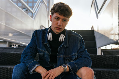 Portrait of young man sitting outdoors