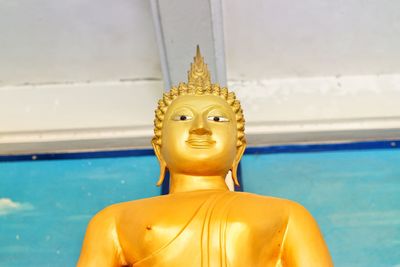 Close-up of statue against swimming pool