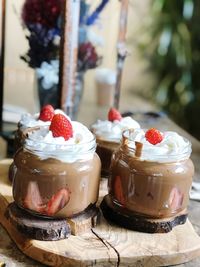 Close-up of dessert in glass containers on table