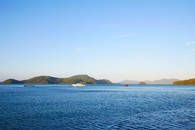 Scenic view of sea against blue sky