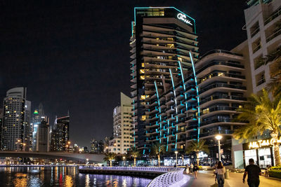 Illuminated buildings in city at night