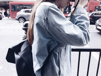 Midsection of man standing on street