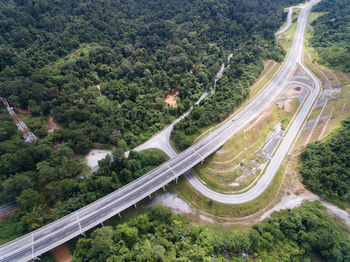 High angle view of highway amidst trees in city