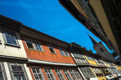 Low angle view of building against blue sky