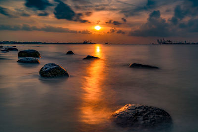 Scenic view of sea against sky during sunset