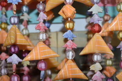Close-up of decorations hanging at market stall