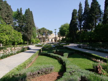 View of formal garden against clear sky