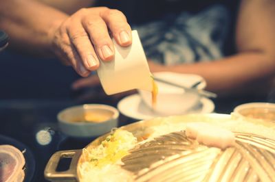 Close-up of person preparing food