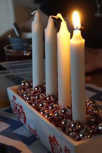 Close-up of candles on table