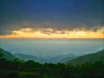 Scenic view of dramatic sky over landscape