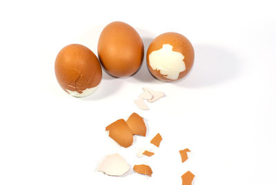 Close-up of eggs against white background