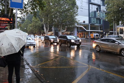 Rear view of wet city street during rainy season