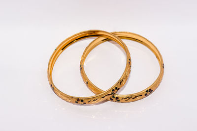 High angle view of wedding rings on white background