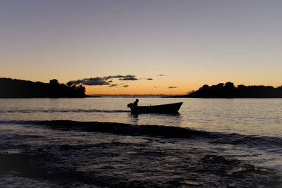 Scenic view of sea against clear sky during sunset