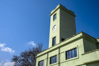 Low angle view of building against clear blue sky