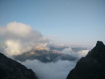 View of mountain range against cloudy sky