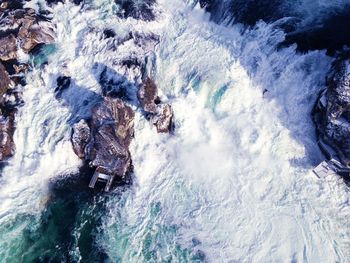 High angle view of water flowing through rocks