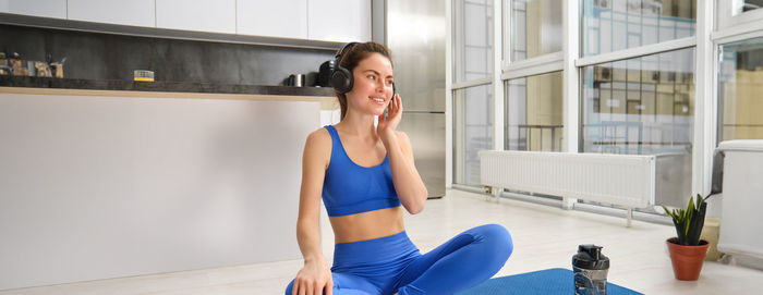 Young woman exercising in gym