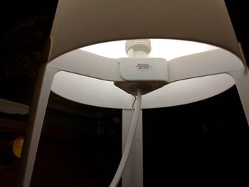 Low angle view of illuminated electric lamp