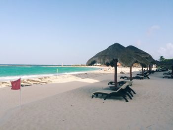 Scenic view of beach against clear sky