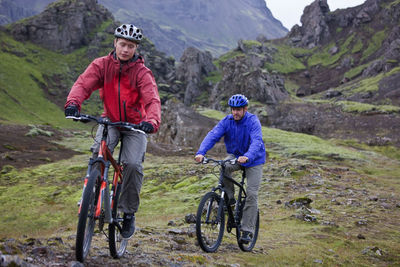 Two friends riding their mountain bikes around lake thingvellir