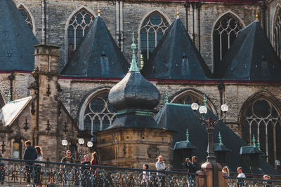 Group of people in temple outside building