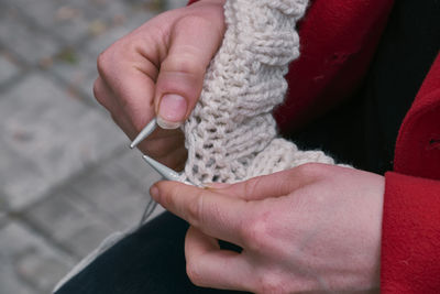 Cropped hands knitting wool