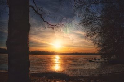 Scenic view of lake against sky during sunset