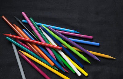 Directly above shot of colored pencils on table