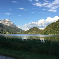 Scenic view of lake and mountains against sky