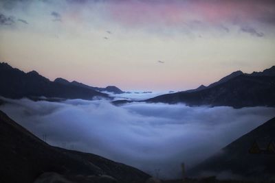 Scenic view of mountains against sky during sunset