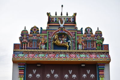 Swami statues are painted in colors on the temple towers of tamil nadu