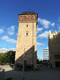 Low angle view of clock tower against sky