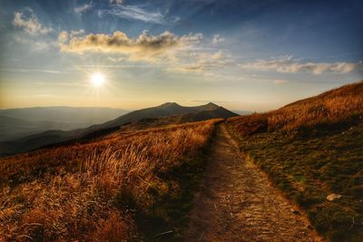 Scenic view of landscape against sky during sunset