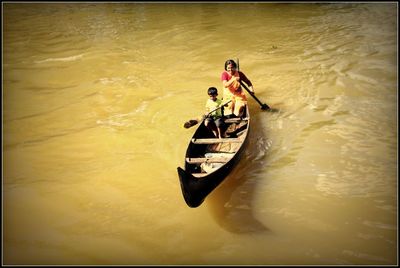 High angle view of people in boat on river