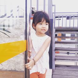 Portrait of cute girl standing outdoors