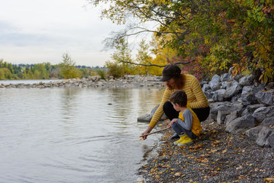 Mother and son enjoying time together by the river