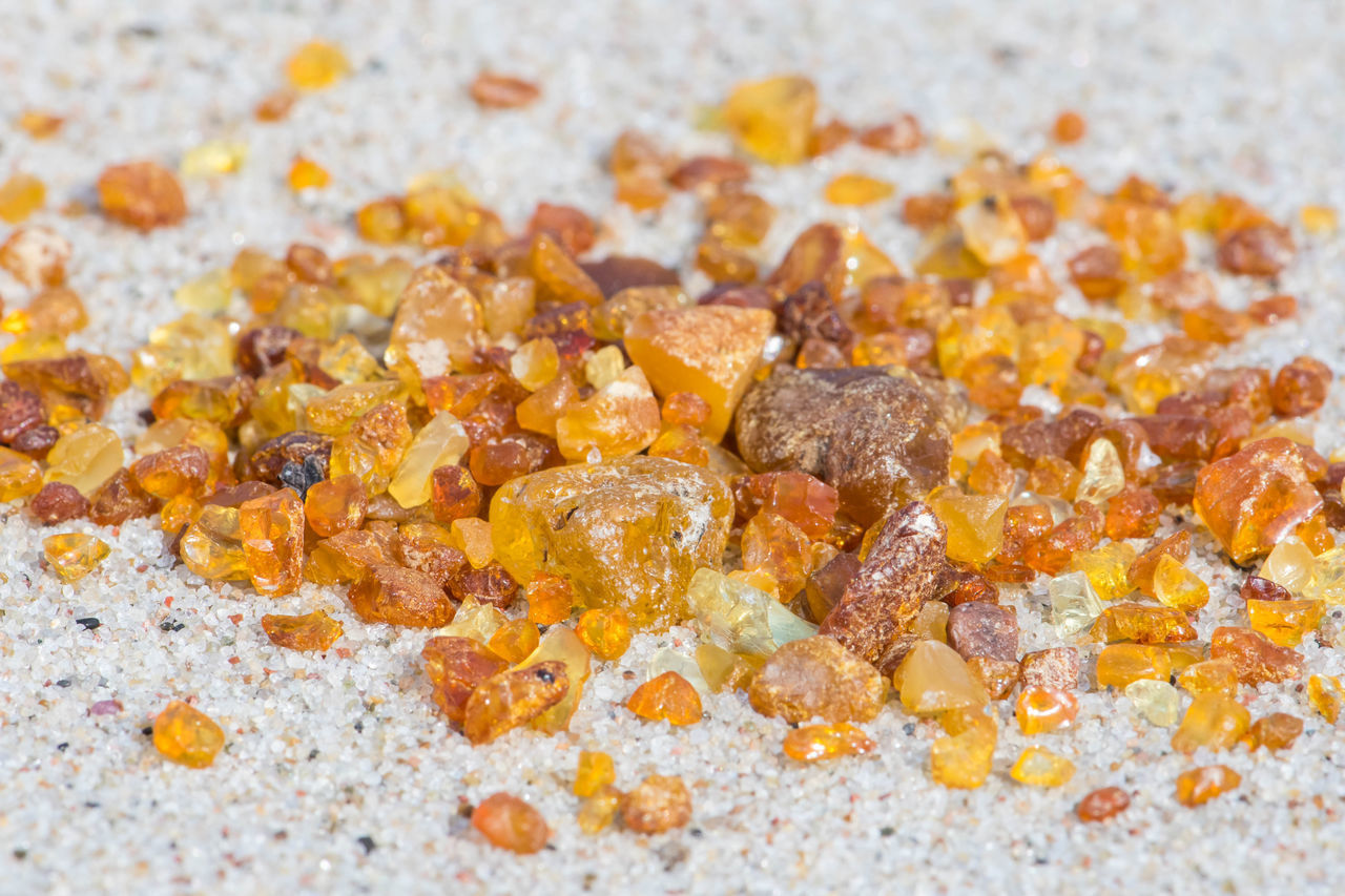 CLOSE-UP OF CHOPPED BREAD ON ORANGE SURFACE