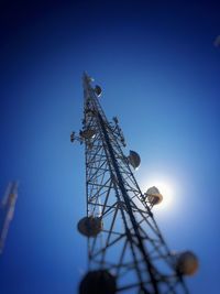 Low angle view of tower against blue sky