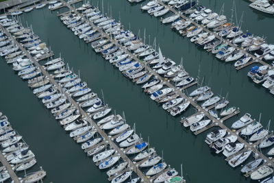 High angle view of boats moored at harbor