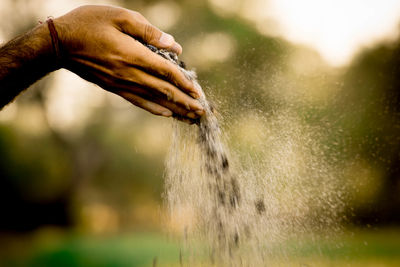 Close-up of hand holding water