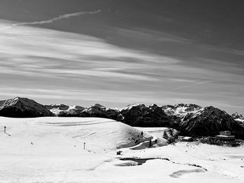 Scenic view of snow covered landscape against sky