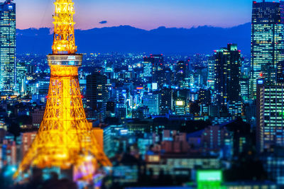 Illuminated buildings in city at night