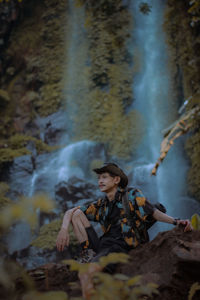 Woman looking at waterfall