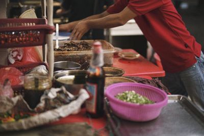 Close-up of man preparing food