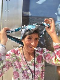 Portrait of woman photographing