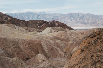 Hikers on the scenic path of death valley's zabriskie point