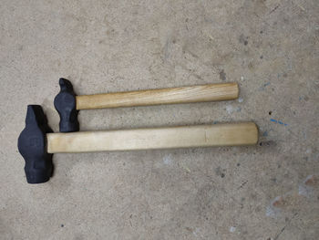 High angle view of human feet on concrete floor