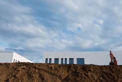 Built structure on beach against sky