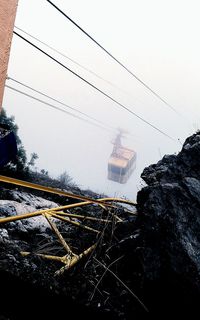 Railroad tracks against clear sky during winter